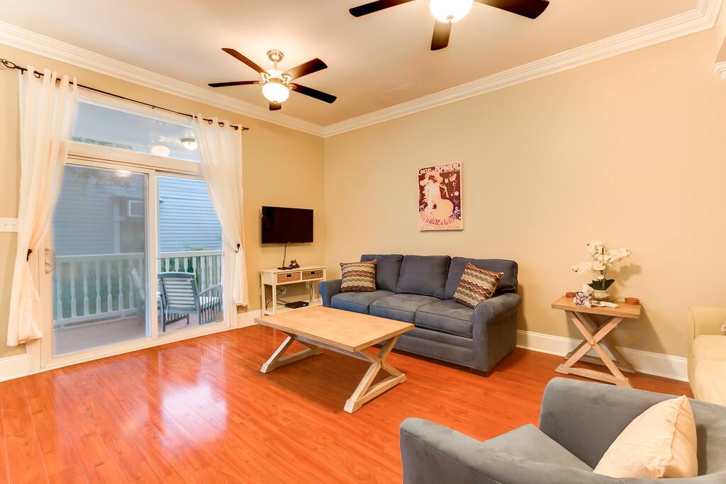 Living room opens to back porch. Smart TV with Netflix, HBO, ESPN & much more.