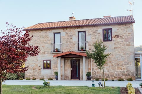 A nice house with a large garden and an indoor barbecue