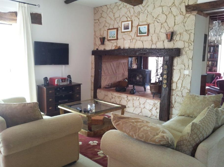 The drawing room/main sitting room facing the dual aspect inglenook fireplace with wood burner