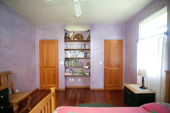 Shelves hold an array of books and games.