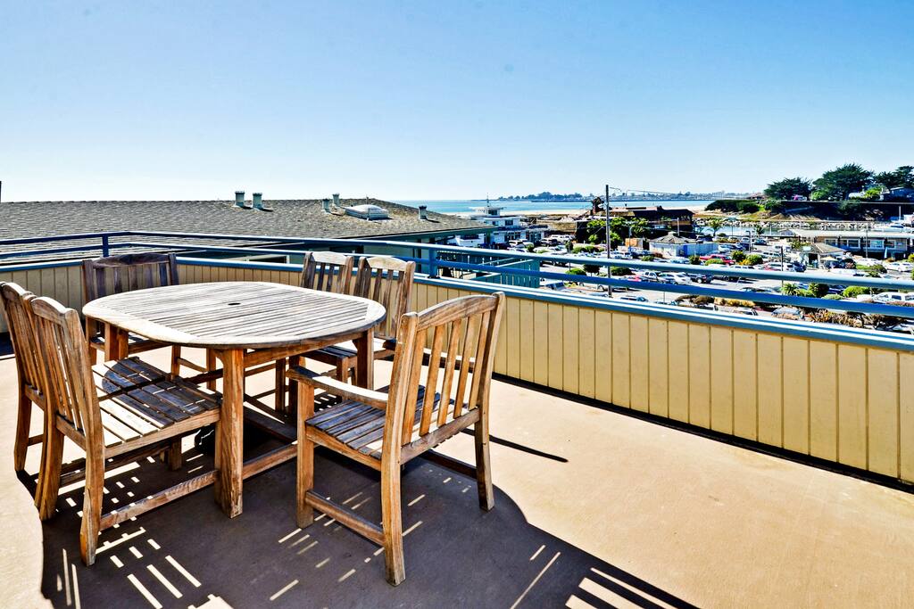 The deck has views of Twin Lakes Beach and the Harbor