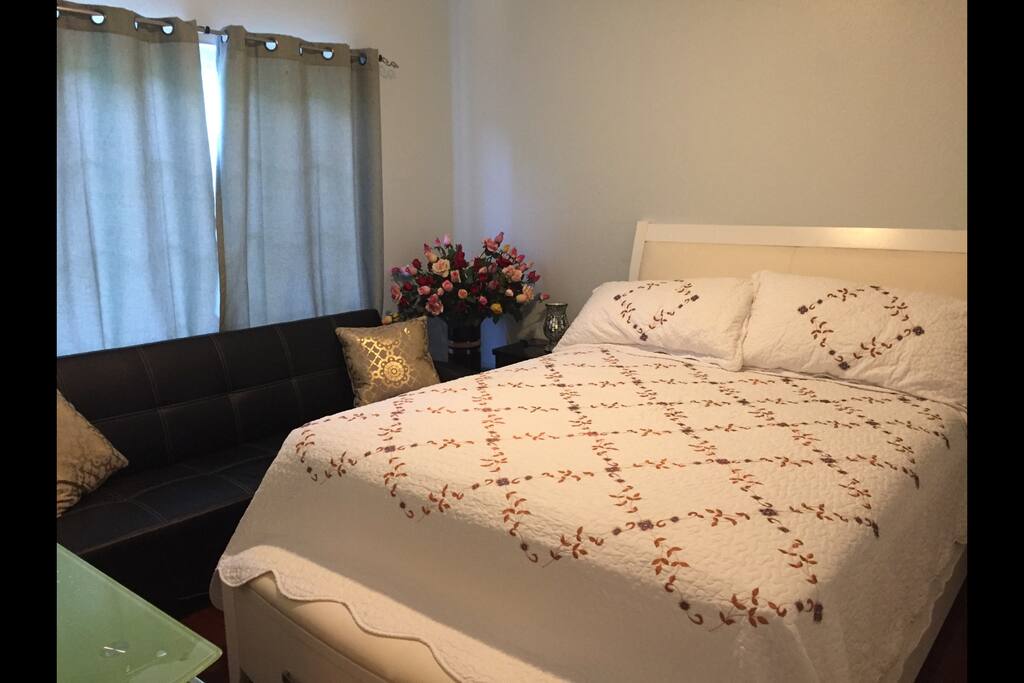 The totally separate bedroom has a queen size bed and a full size futon.