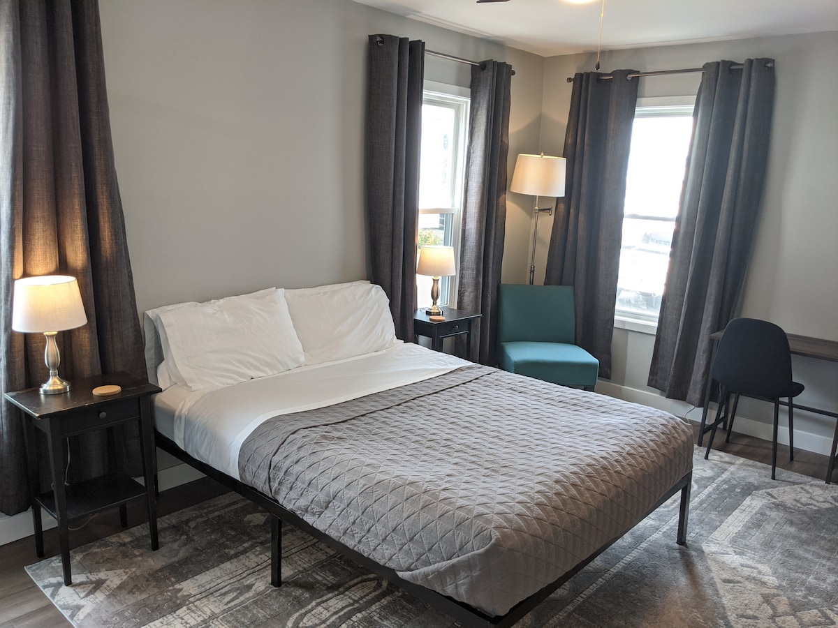 This is the bright master bedroom with queen size bed.