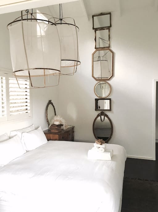 The master suite is adorned by antique mirrors layered down the 8 meter ceiling
