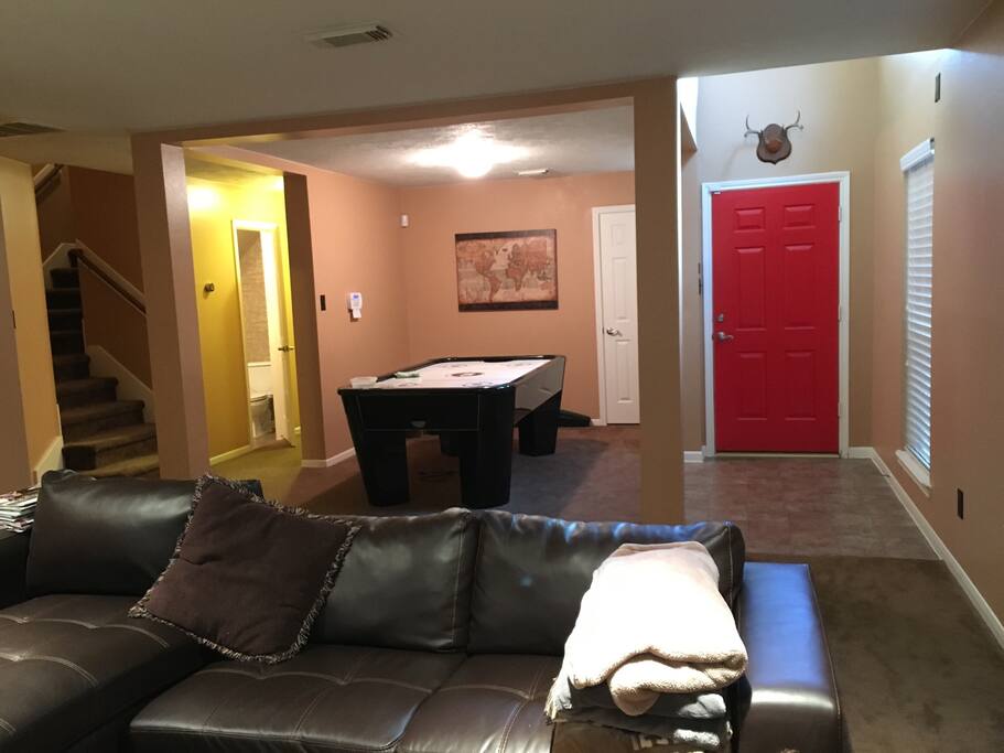 Air hockey table, ample lighting, spacious area downstairs