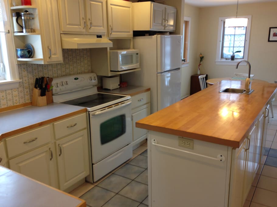 Kitchen showing large island with second sink