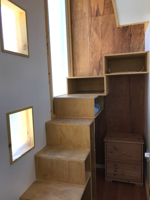 Stairs to the loft with storage cubbies.