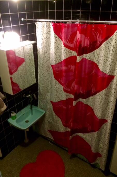 Bathroom with shower and a bathtub.