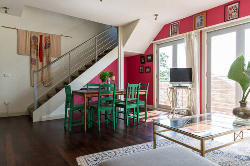 Lounge, dining, kitchen open plan. ground floor with spectacular fitzroy rooftop views..