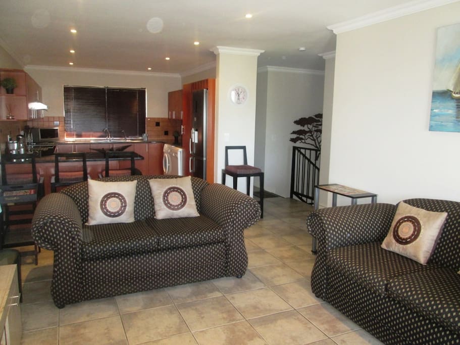 Open plan lounge towards kitchen