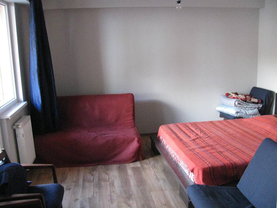 The couch has been replaced by a cabinet.