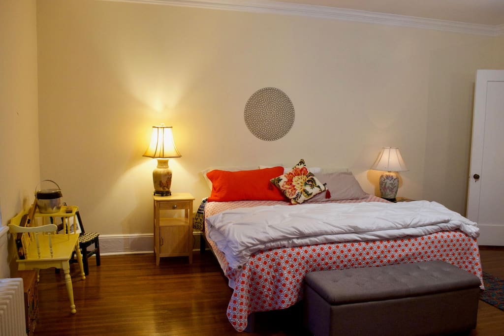The yellow room is our biggest room with a king bed, lounge chair and desk.