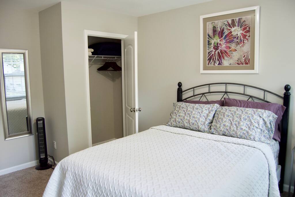 Plenty of closet space with hangers and extra blanket and pillows