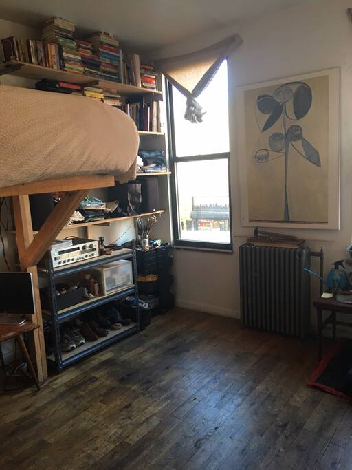 Lots of books, hardwood floors and art.