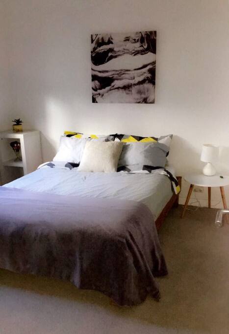 Comfortable double bed with four pillows, a doona & an extra blanket.
Bedside table with lamp & a heater.