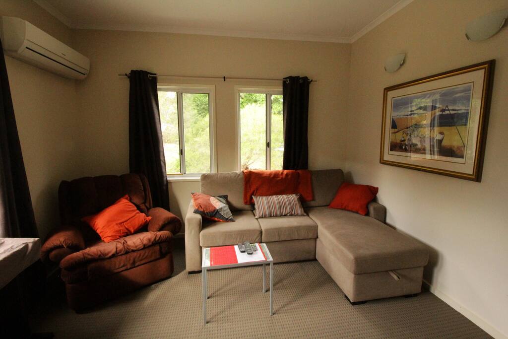Lounge room with reclining chairs, double sofa bed and 50" TV with Netflix to relax in the evenings.