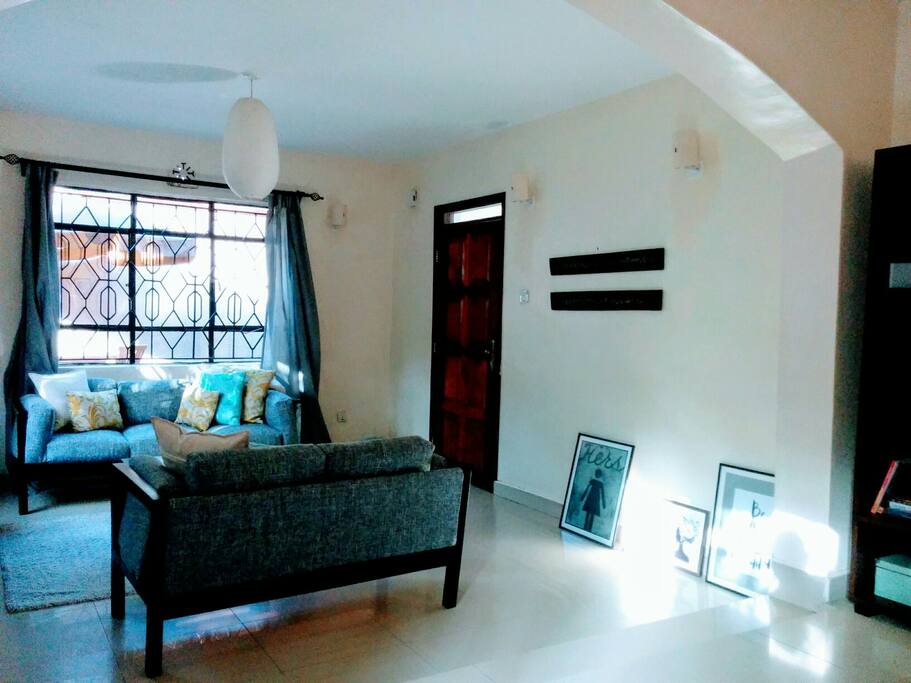 The living room has an abundance of light and adequate space to move around.