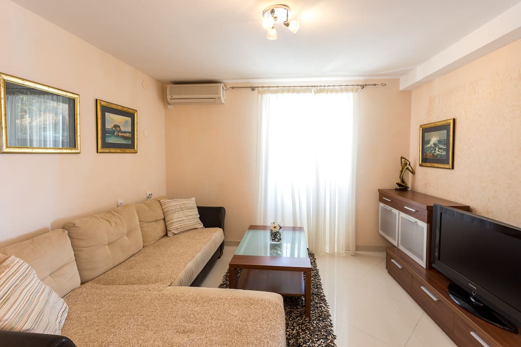 Living room with sofa bed, flat TV with cable channels, air conditioned and very comfortable