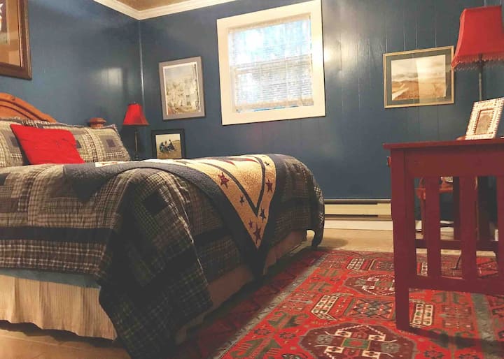 The master bedroom is cozy and inviting. Complete with authentic rugs, closet for your belongings, and a ceiling fan. Multiple lamps are also provided for reading light.