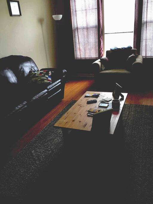 Living room with another chair that converts to twin bed
