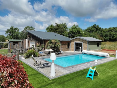 Property with a pool and a hot tub