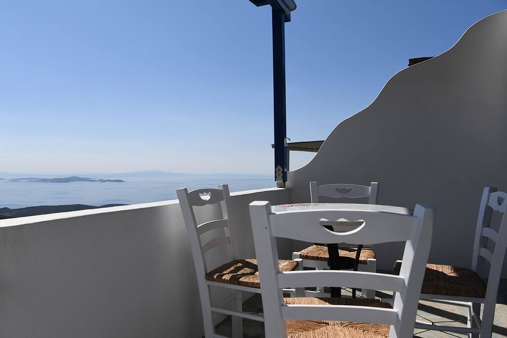 Marble table seating 4, view of Aegean sea.