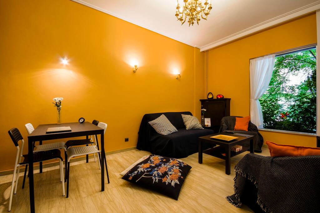 Minimal design with classical chandeliers are bound together in this cute downtown flat.