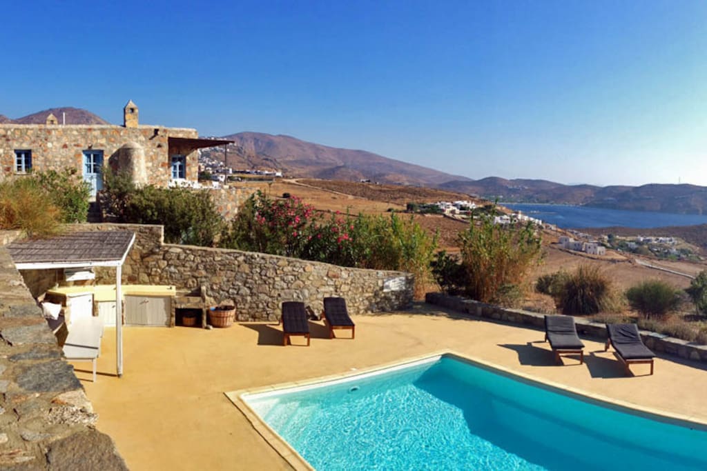 The swimming pool area with the Stone House in the background
