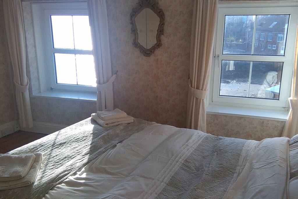 Bedroom 1 - King size double bed - two windows looking at the sea.