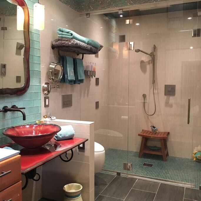 Luxury all glass sink, mirror and shelf, makeup mirror, cabinet and drawer space for your personal bathroom things, blow dryer, shower caps, body wash, shampoo and conditioner.
First Aid Kit in top drawer and sewing kit.
