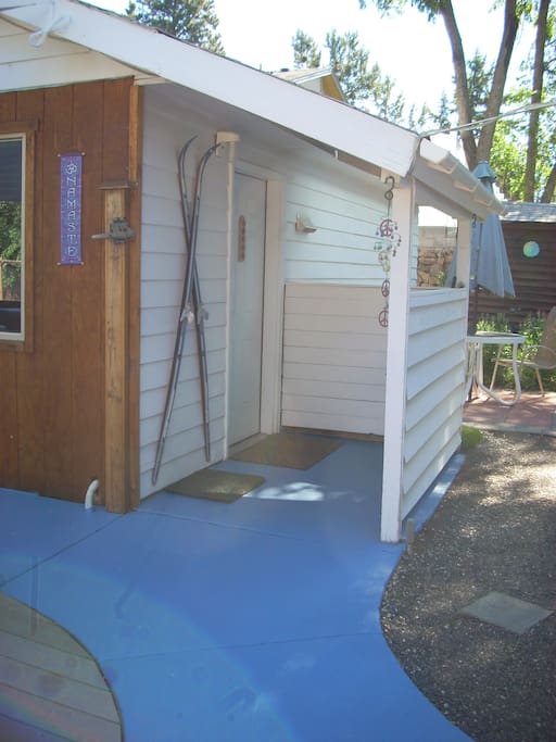 By the skis, under the little porch, is your doorway to the Little House. The courtyard is private, and is safe for your skis, etc.
