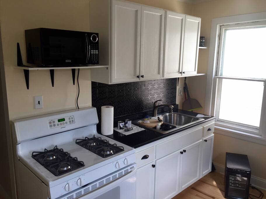not in photo- full size fridge, kitchen table, and more countertop/storage space that was built/installed