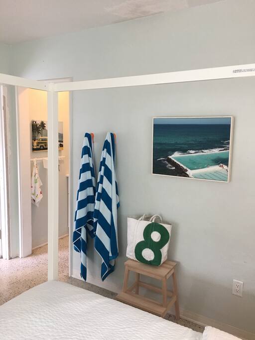 Big fluffy beach towels, beach chairs, umbrella and a cooler.