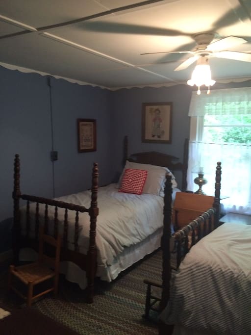 Part of bedroom with two single beds