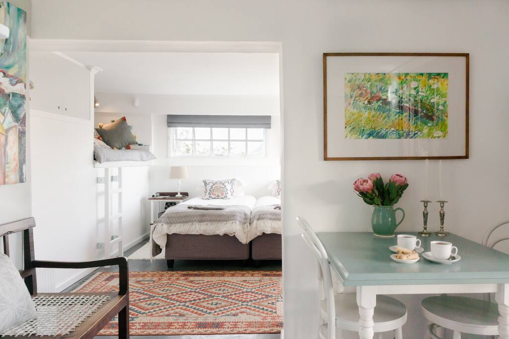 Original artworks adorn the walls in this creative space.