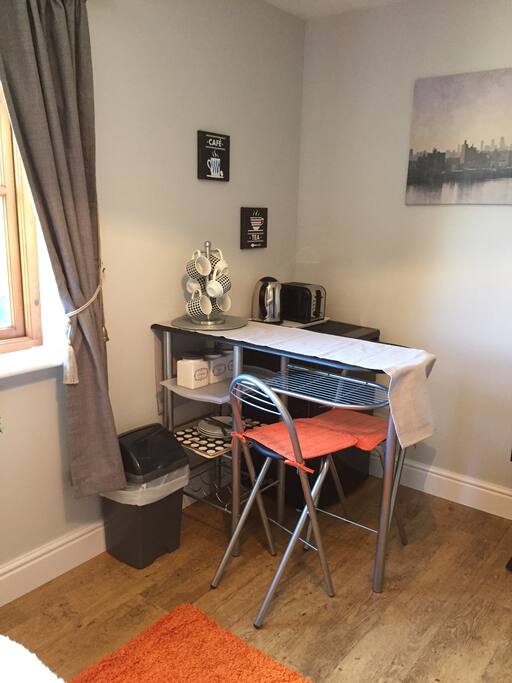 Breakfast bar and large fridge.
