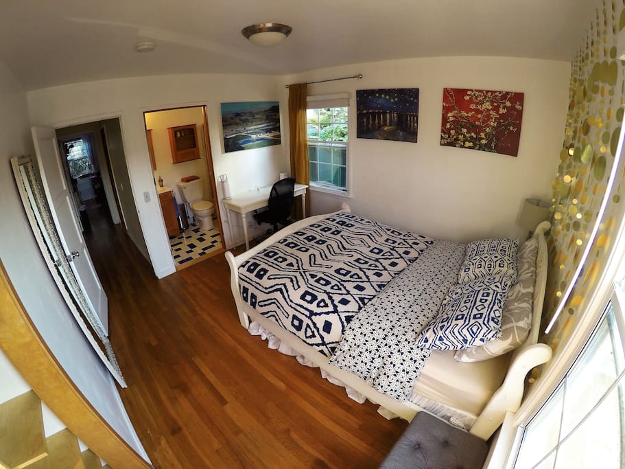 You can see the entrance to your private bathroom. A full length 6ft tall mirror and closet area with 20 clothing hangers plus a fan, iron, and yoga mat for your use.