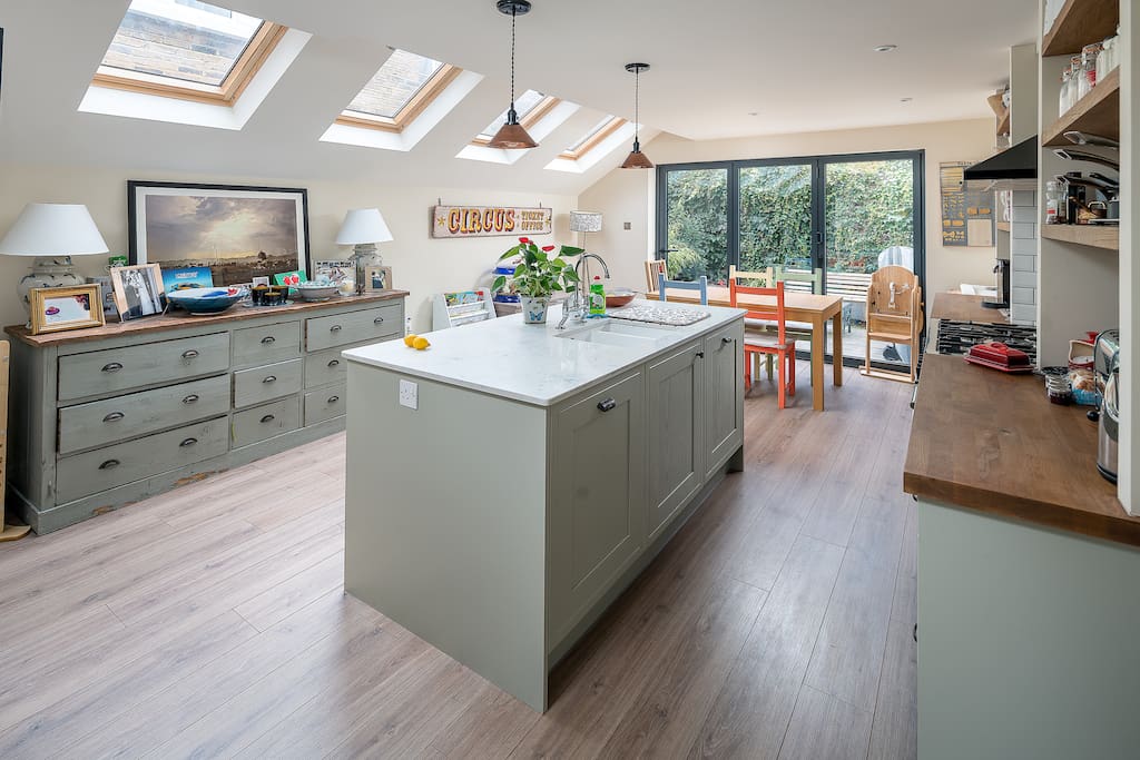 Kitchen with dining area opening out onto the garden - a rarity in London!