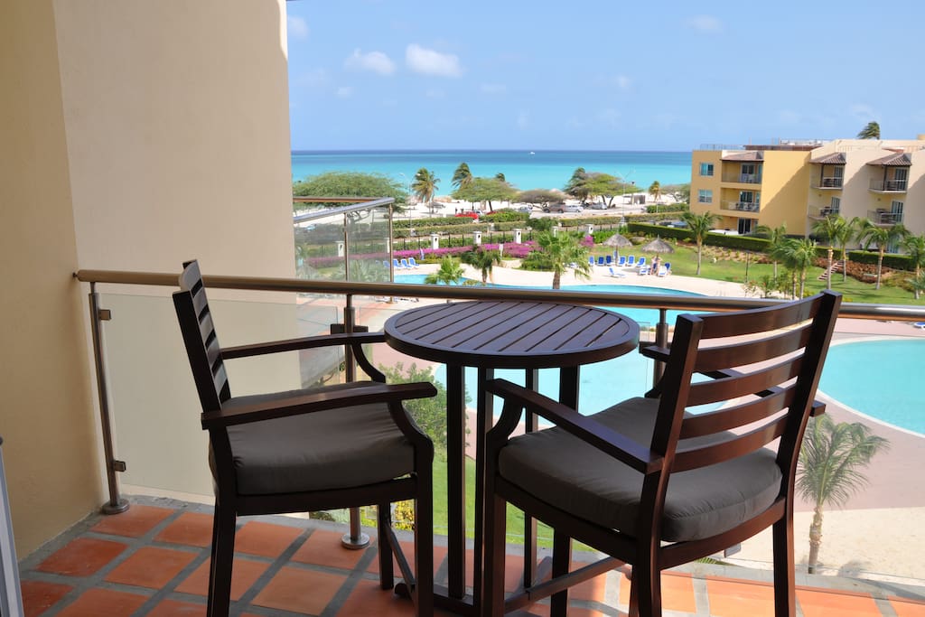 TABLE AND CHAIRS ON BALCONY