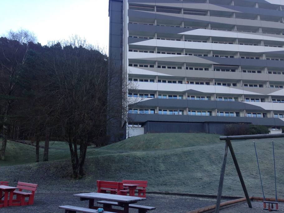 The building with the appartment, which is located far left, 4th level from bottom.