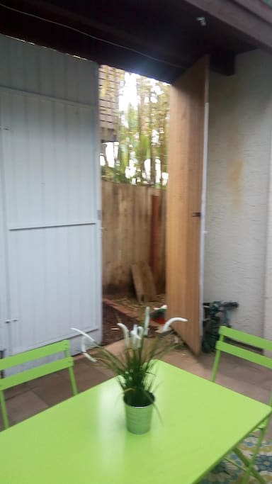 Entrance from side of home into patio and suite