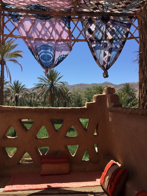 Relaxing in the shade on the terrace, looking out over the Draa and the gardens.