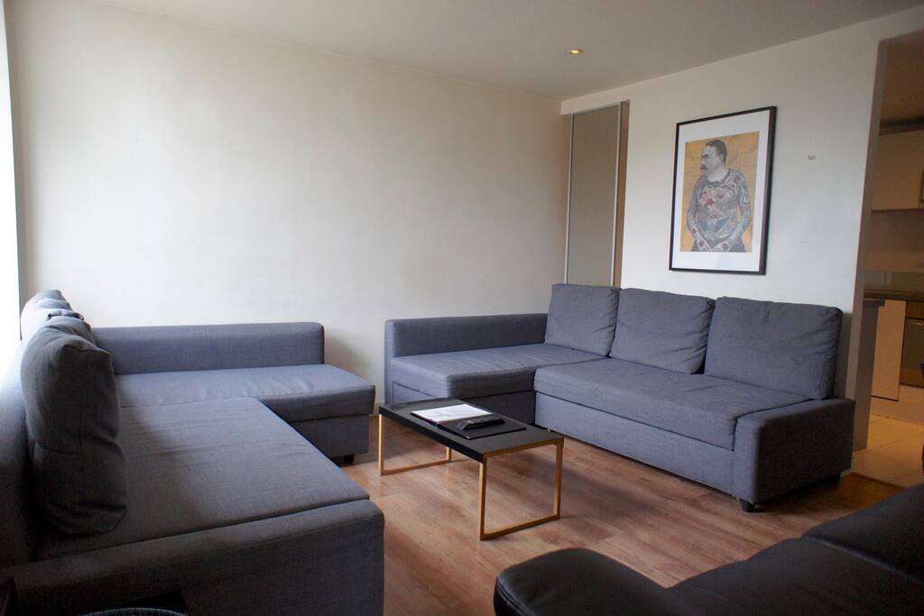 Here's your living room with balcony and two double sofa beds