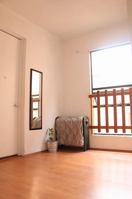 Super luminous room and so spacious! Extra mattress can be placed in the floor if needed.