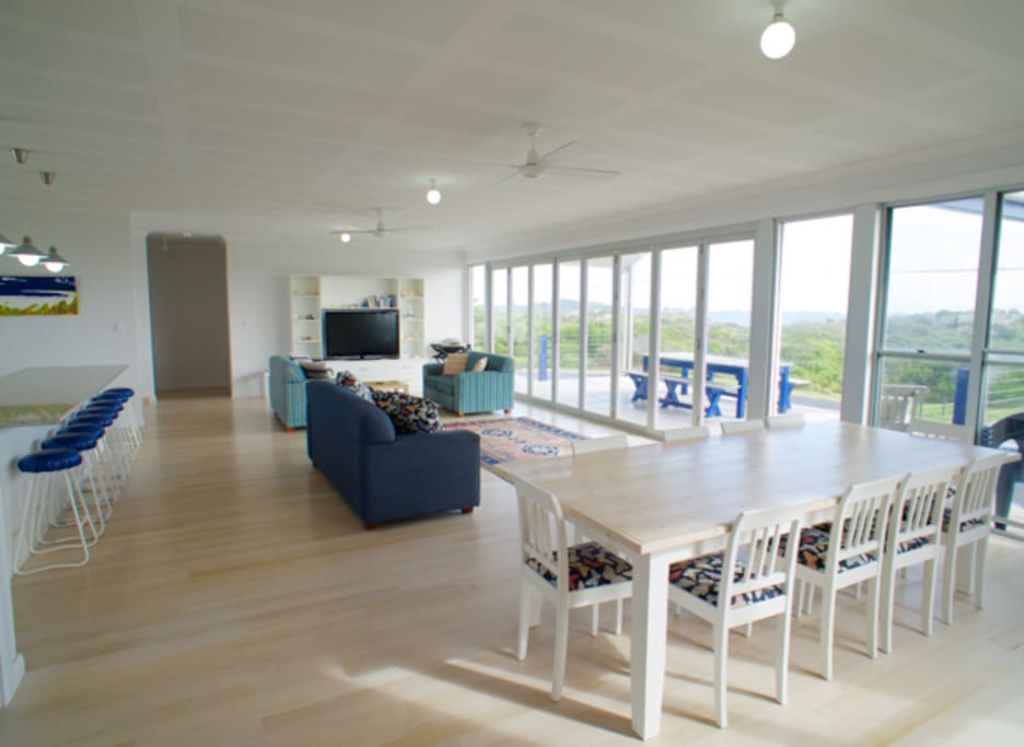 Open plan kitchen, dining and living area with a nice sea view.