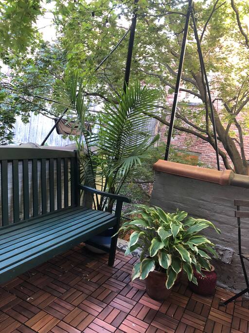 Lots of plants and plenty of seating on our beautiful patio!