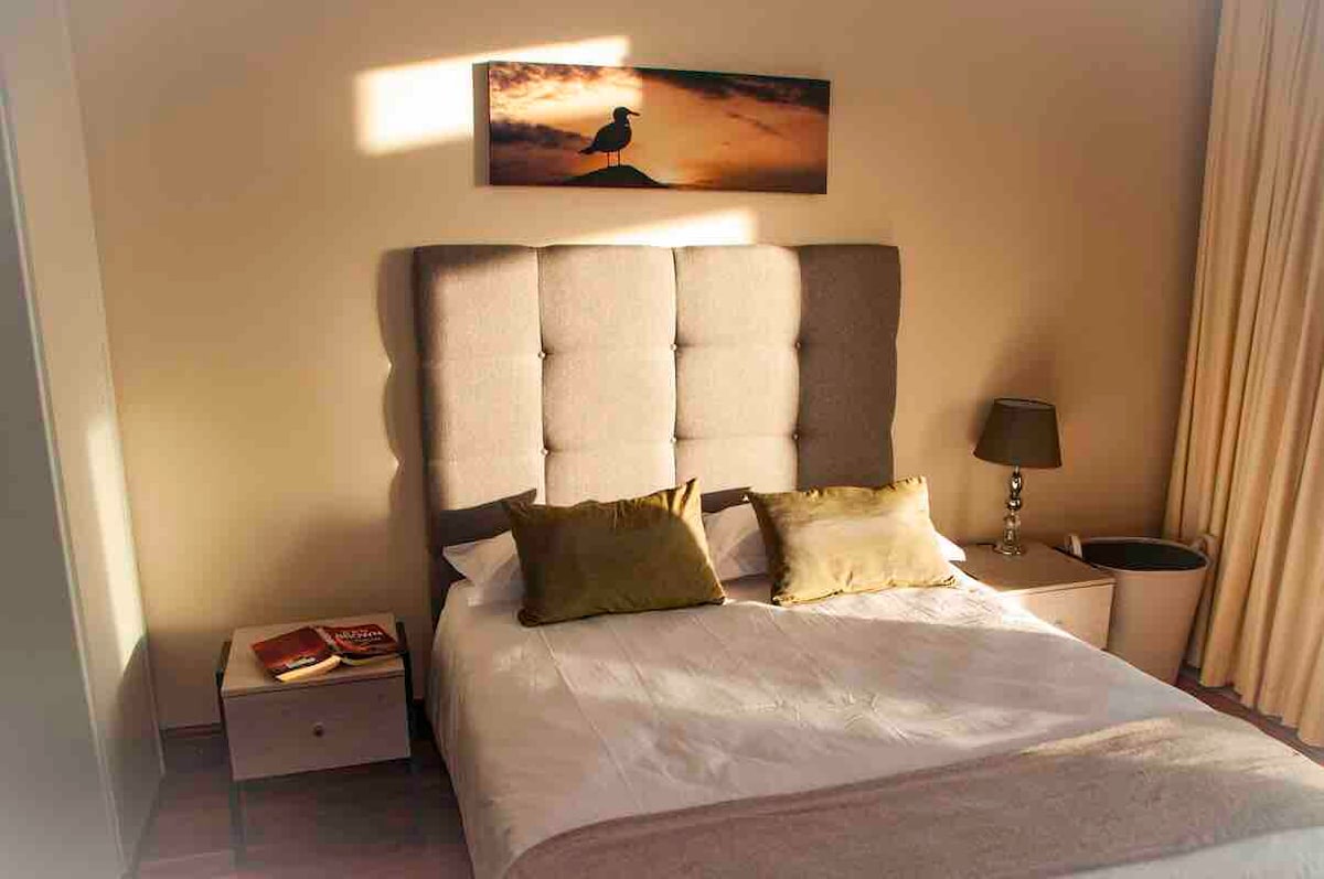 Bedroom 1 
Large bathroom with shower en suite. Beautiful views of the sea and sun set. Access to balcony.