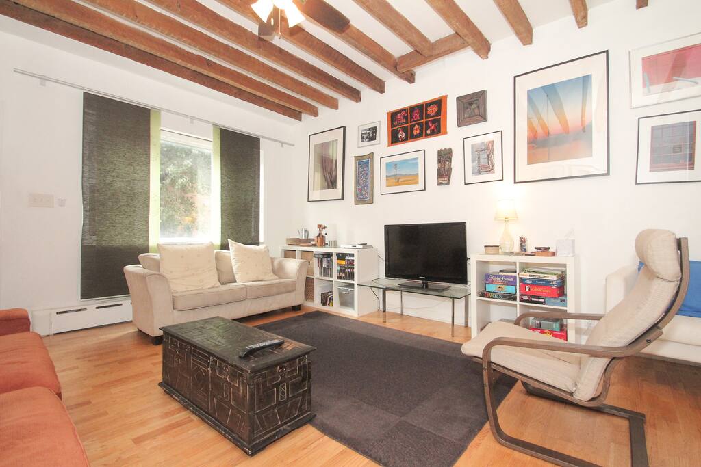 Well appointed living room with unique artwork -also has TV, board games, DVD's and CD's for your entertainment.