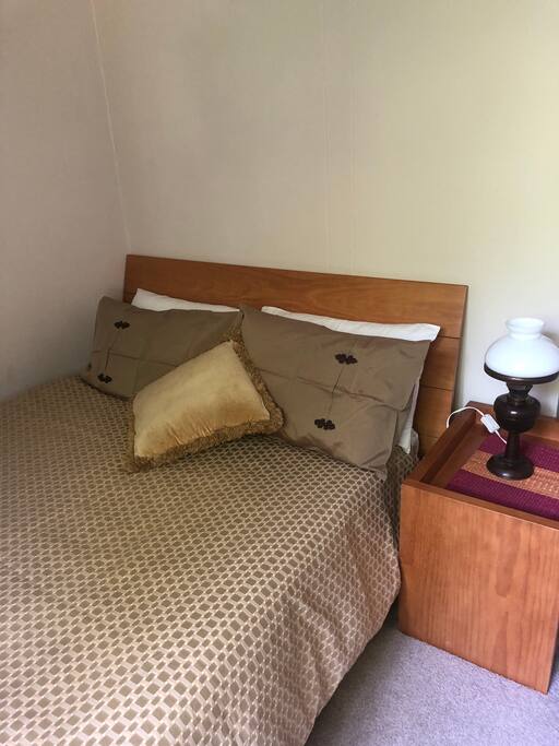 Double bedroom with built in wardrobe, tall boy and mirror