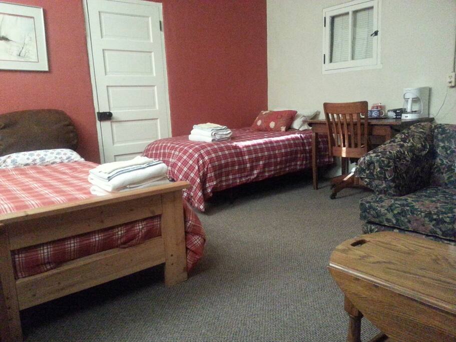 The room includes a full bed and a twin bed.